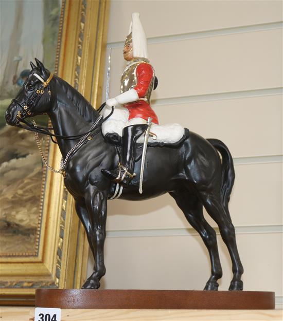 A Beswick group of a Lifeguard, wood stand height 35cm excl. base